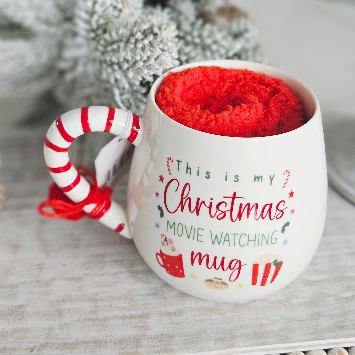 Christmas movie watching mug with fluffy socks and gift box
