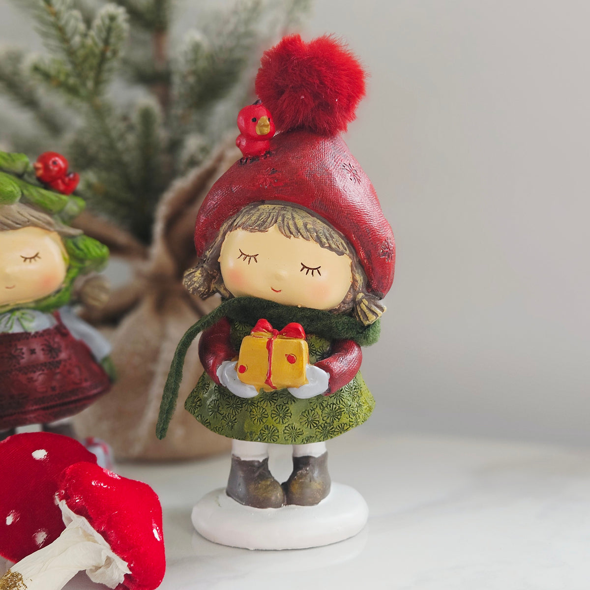 Standing Resin Christmas Girl with Gift, Scarf & Pom Pom Hat