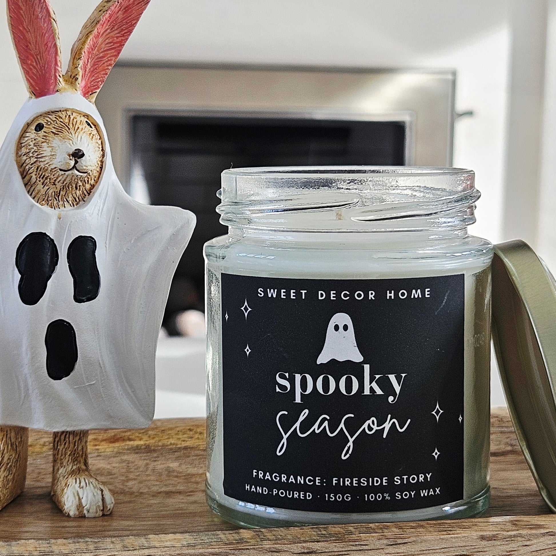 Candle jar labeled 'Spooky Season' 190ml 100% soy wax fragrance fireside story
