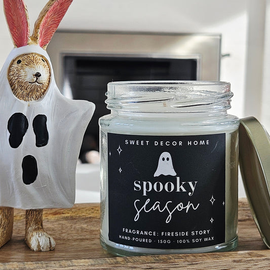 Candle jar labeled 'Spooky Season' 190ml 100% soy wax fragrance fireside story