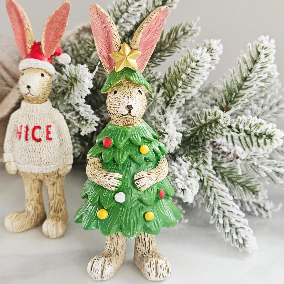 jasper bunny dressed in a green christmas tree costume with decorative baubles and star top