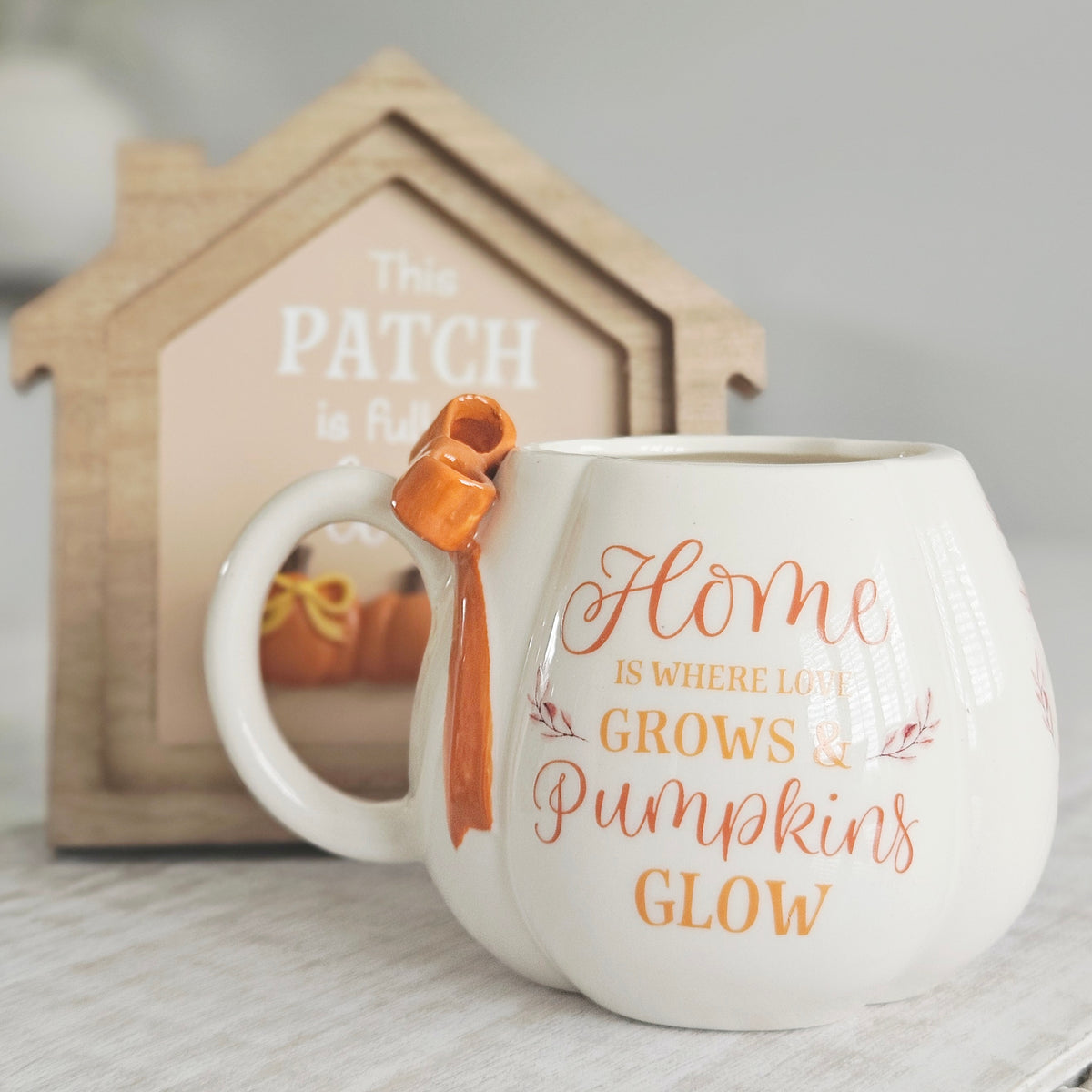 Harvest Home stoneware pumpkin shaped mug with 3D bow detail presented in a matching gift box, perfect for autumn coffee, tea and seasonal home décor.
