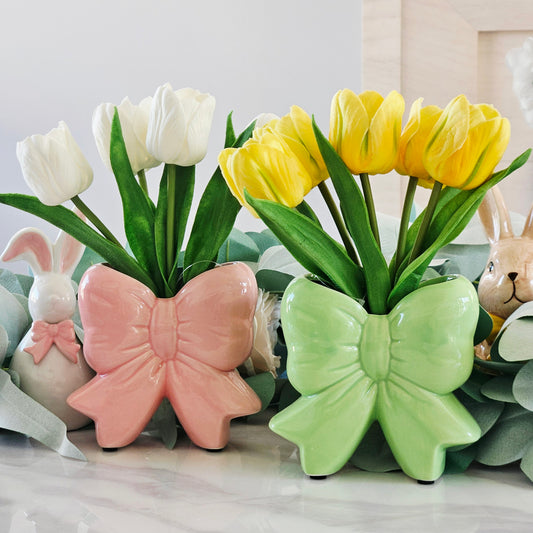 pink and green bow vase tulips with white and yellow tulips