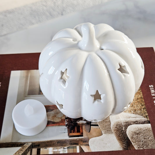 White ceramic tea light holder  pumpkin with star cutouts 