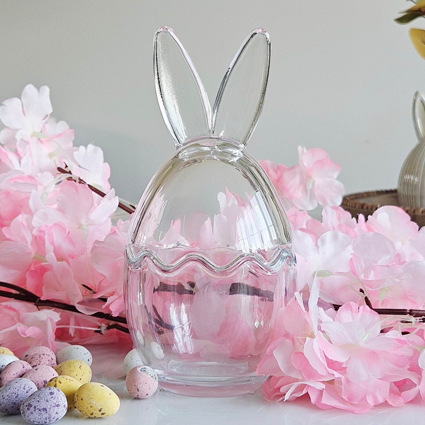 Clear glass bunny-shaped egg holder with bunny ears storage treats