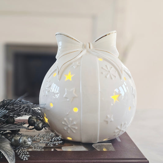 Porcelain LED Christmas bow bauble with gold details and decorative star cut-outs
