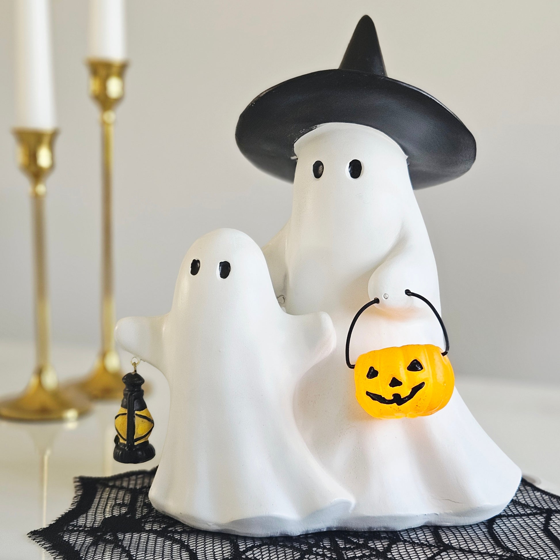 Resin ghosts holding a light up lantern Halloween LED decoration for spooky seasonal home décor