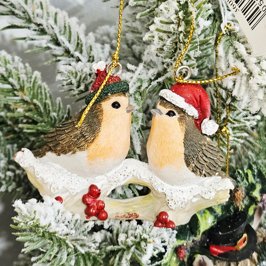 Robin duo Christmas tree hanging decoration on snowy branch