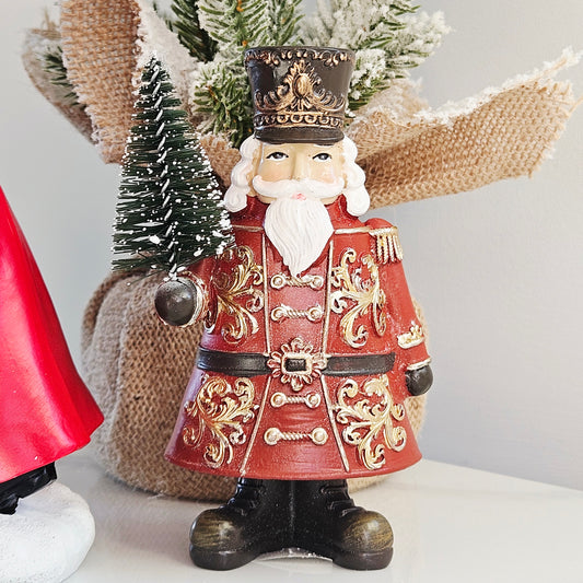 Regal Tidings red and gold nutcracker Christmas figurine with tree
