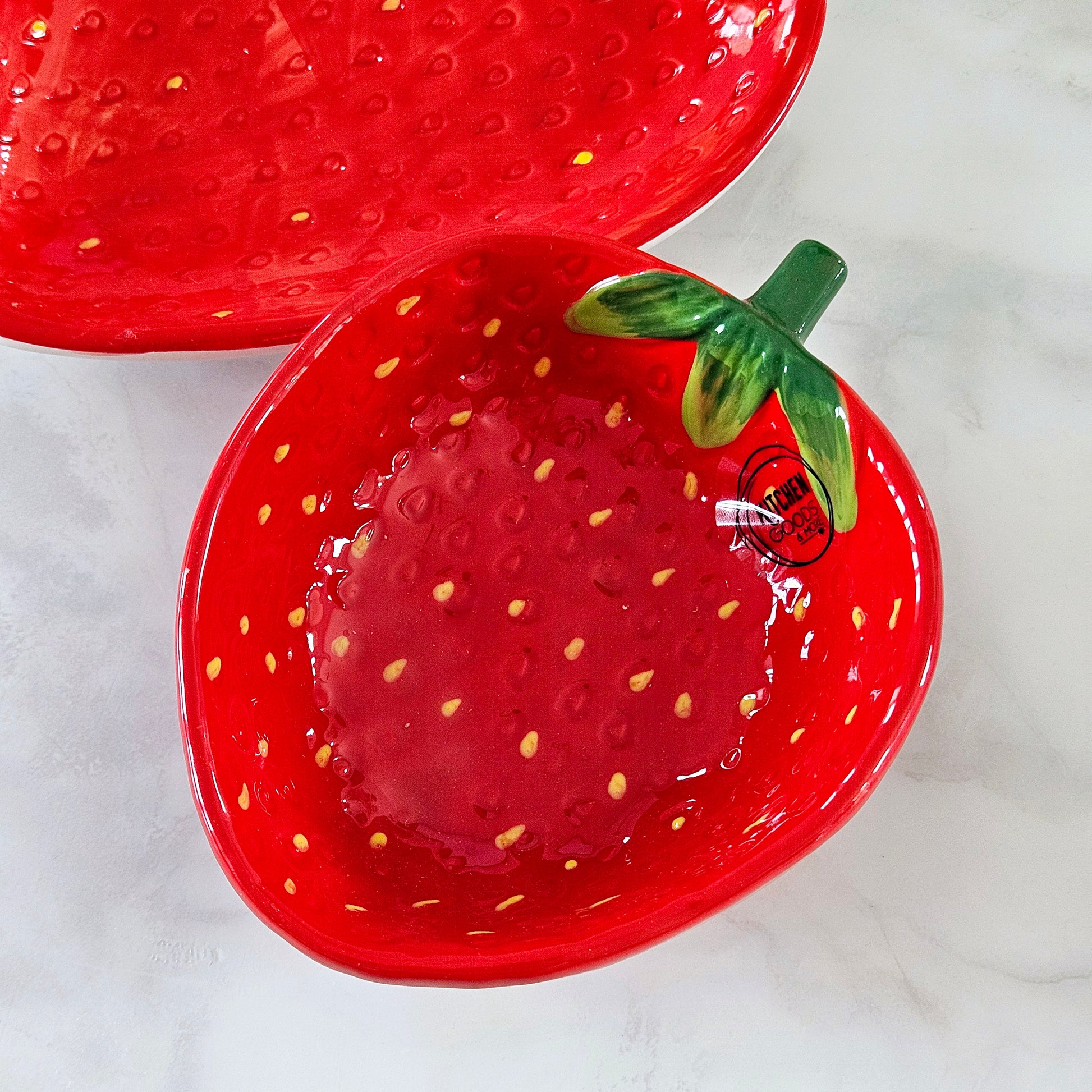 strawberry shaped bowl with pips detail and green stem by kitchen goods