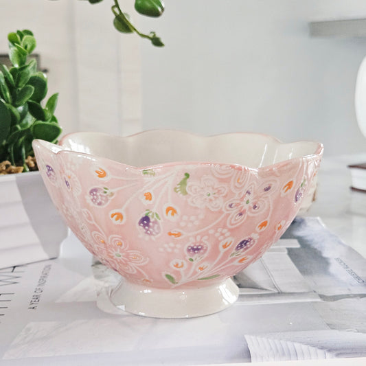 Decorative pink bowl with floral patterns 