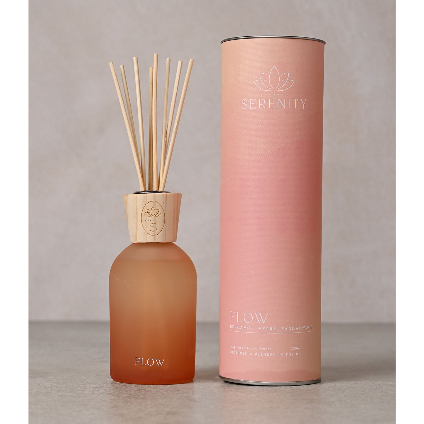 vibrant blend of ombre pink and orange hues in a glass bottle, adorned with an elegant wooden top with lotus flower logo.

Filled with 220ml of aromatic Bergamot, Myrrh, and Sandalwood fragrance made by serenity