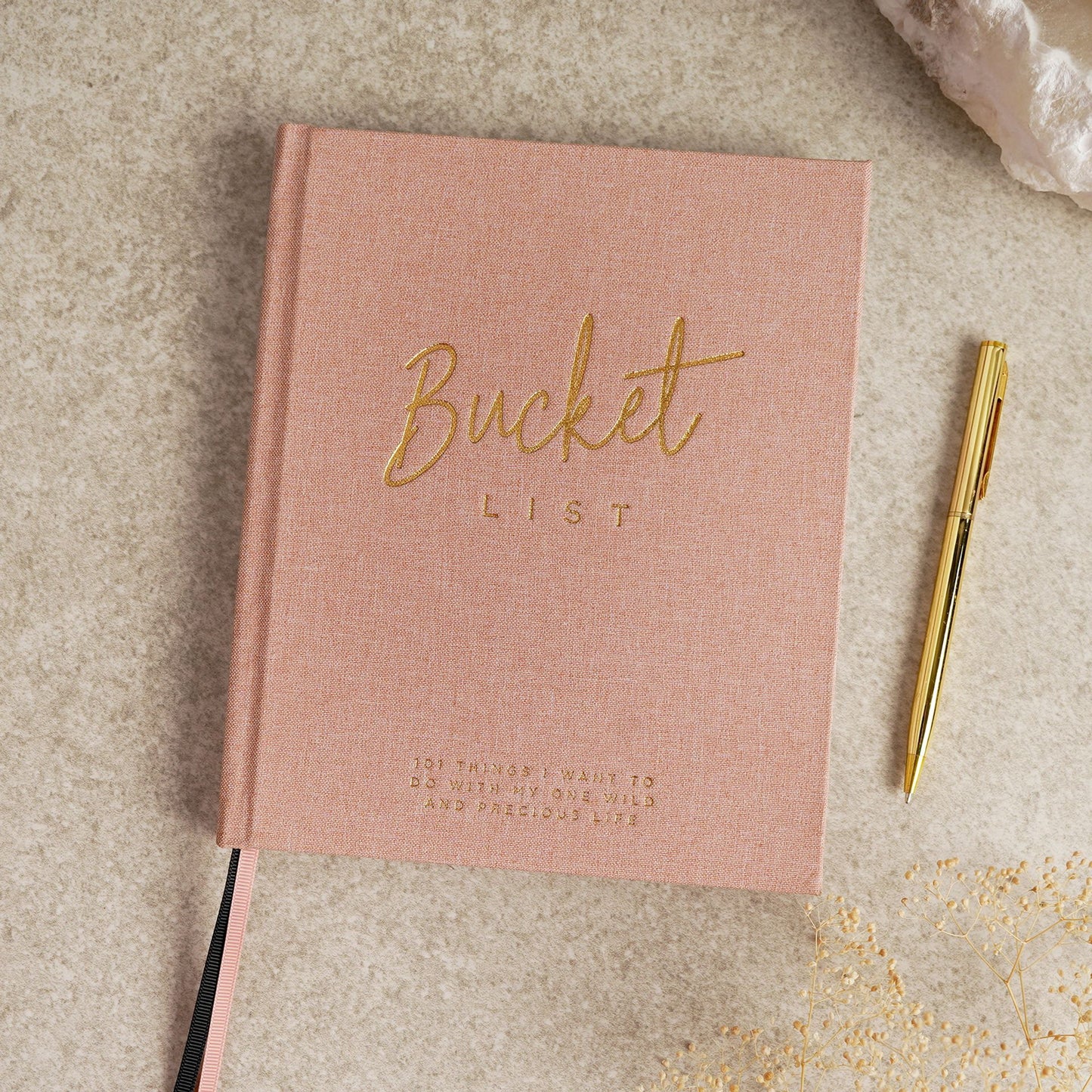 Pink notebook titled 'Bucket List' with a gold pen by serenity 