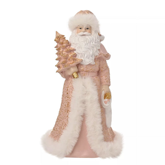 Decorative figure of a Santa Claus dressed in pink holding a gold and pink tree 23cm