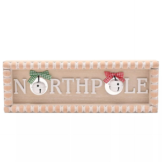 Wooden bobble sign with 'Northpole' text and decorative bells elements 