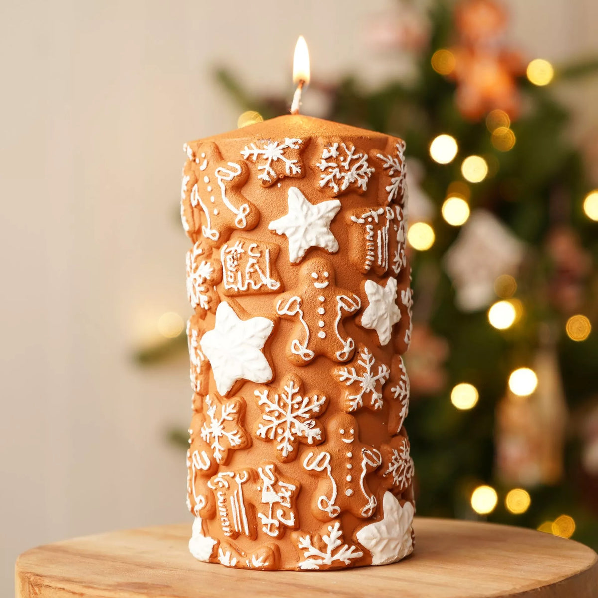 15cm gingerbread embossed Christmas pillar candle with snowflake and star design