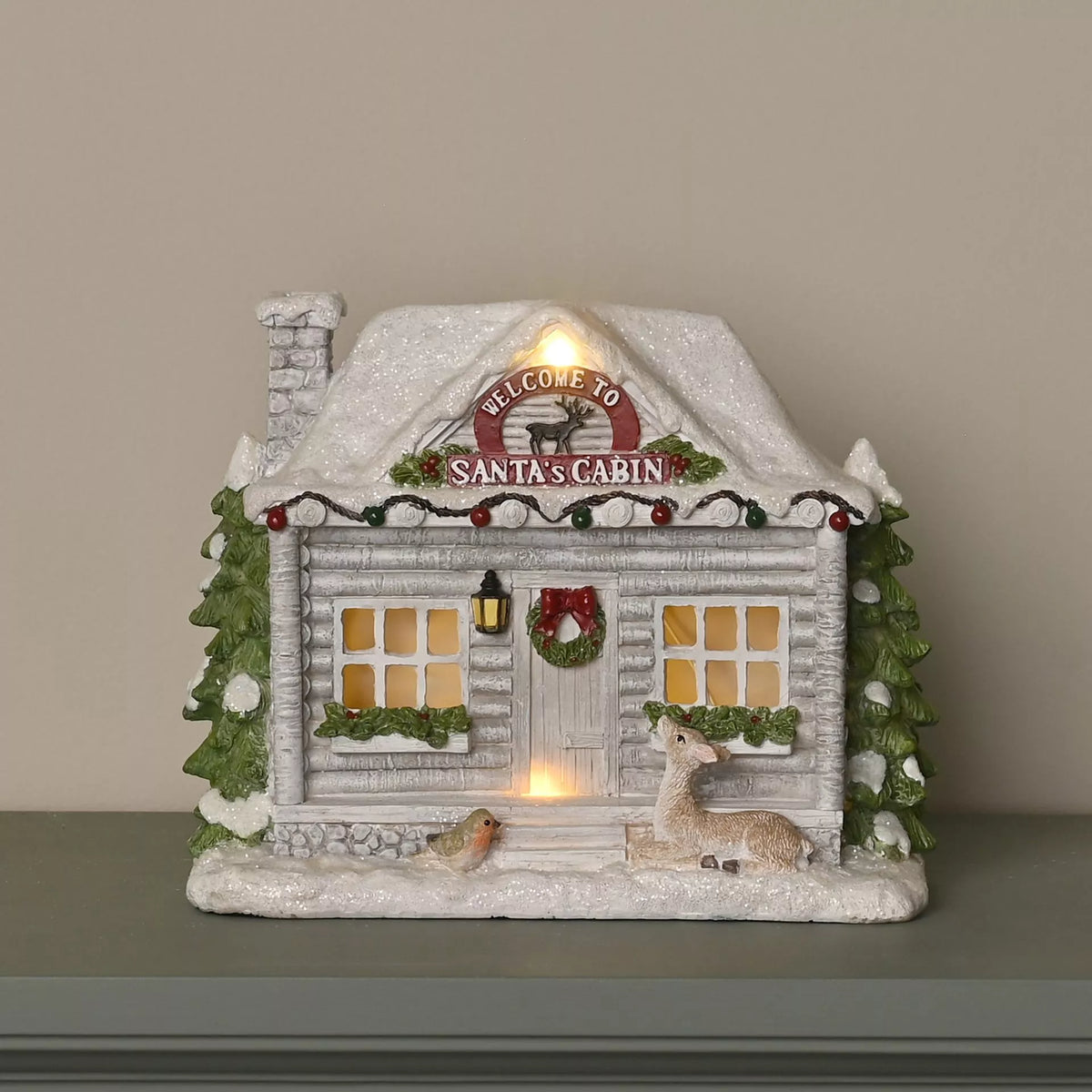 Light up Santa cabin Christmas decoration with snowy log cabin and deer
