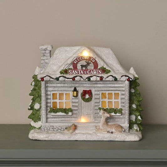 Light up Santa cabin Christmas decoration with snowy log cabin and deer
