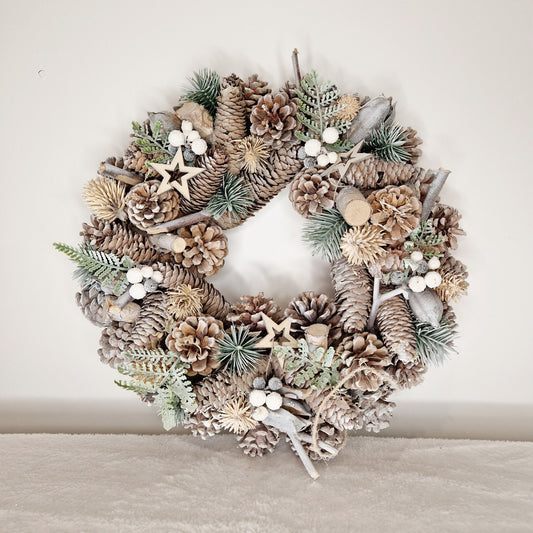 frosted woodland wreath decoration made with a Mixture of Faux and Natural Materials