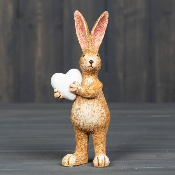 Standing Bunny holding a white heart 