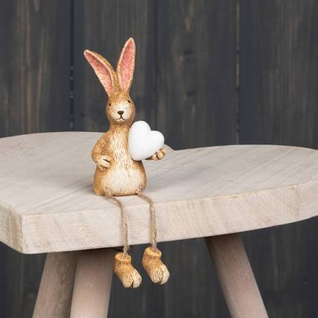 Cute sitting dangly legs rabbit figurine ornament holding a white heart 